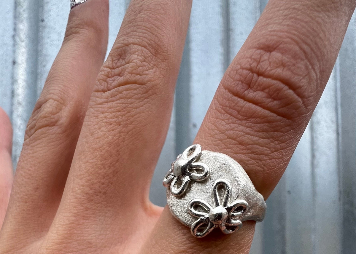 silver signet with flowers